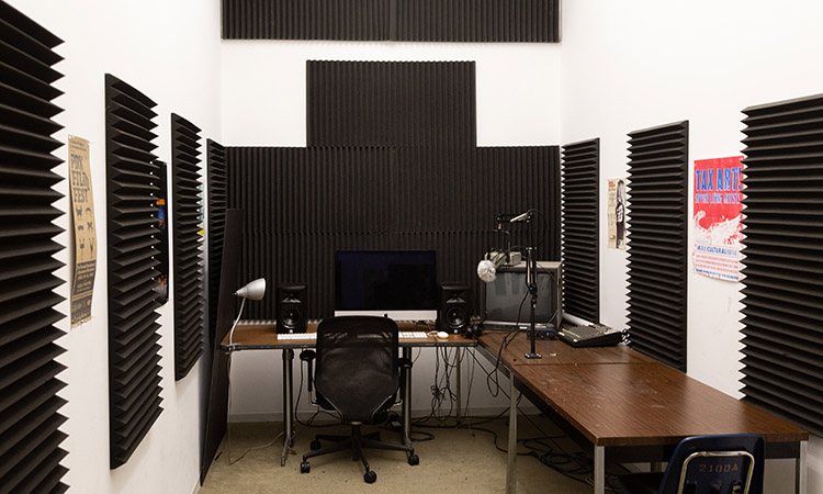 A New Genres sound editing suite with computer and audio equipment