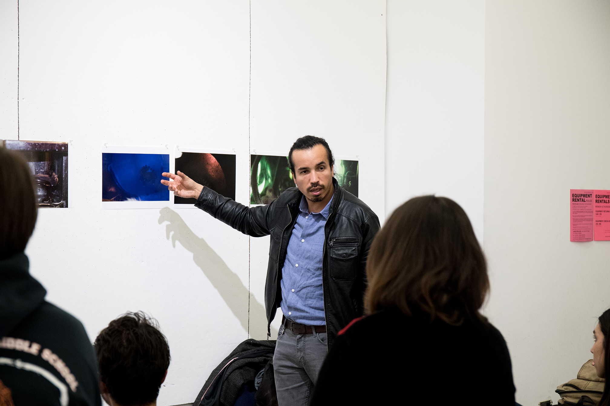 Assistant Professor Rodrigo Valenzeula discusses student work during an undergraduate class critique.